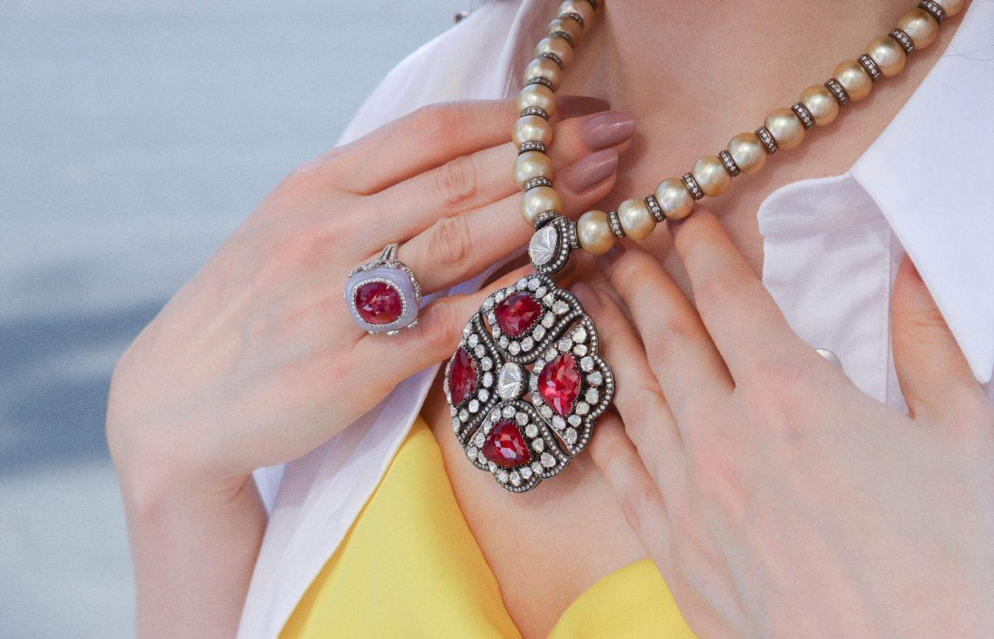  Katerina Perez wearing an Amrapali necklace and ring in gold set with rubies, pearls, lavender jade and diamonds
