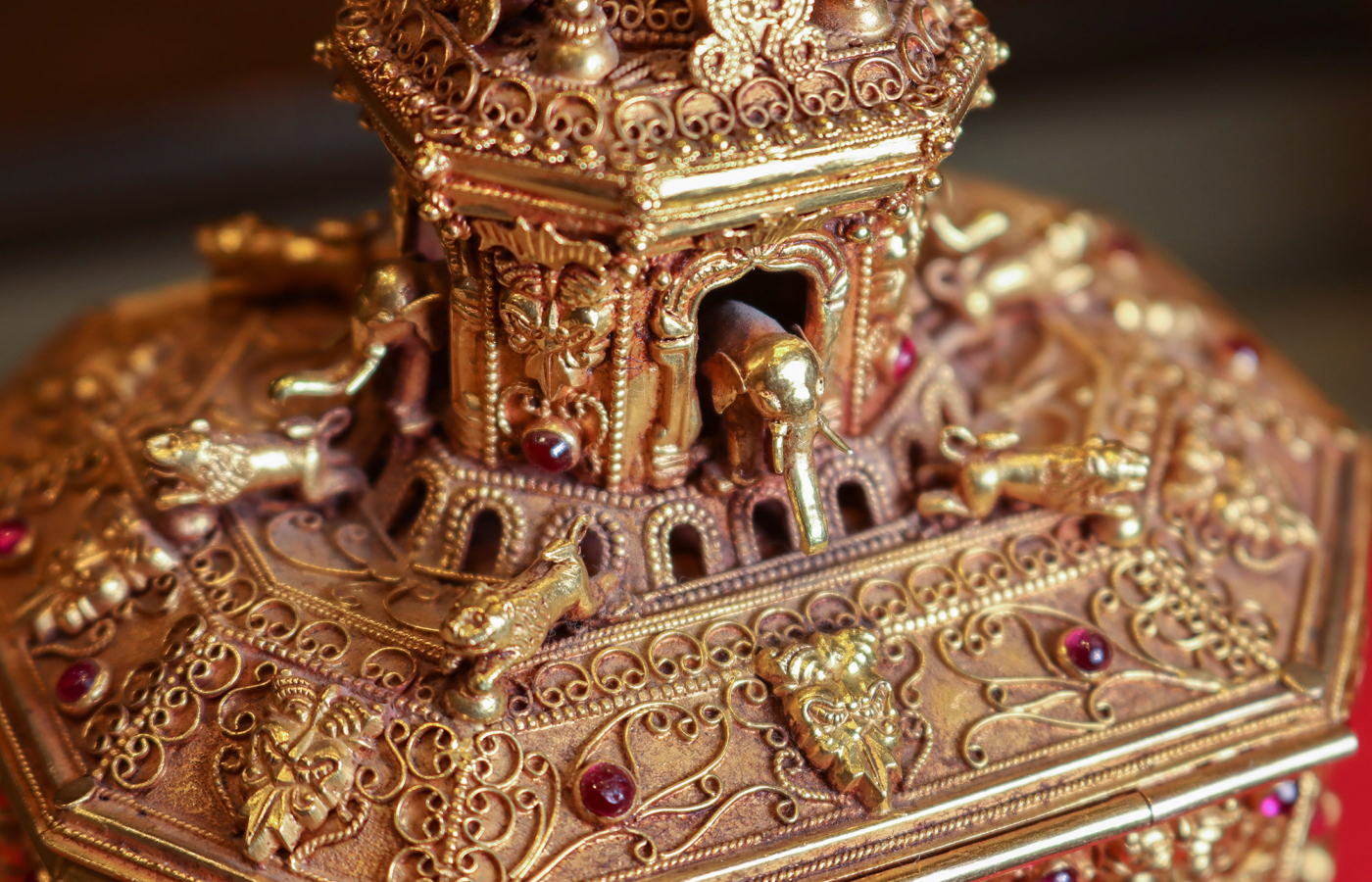 Ornamental object on display at the Amrapali museum in gold set with precious gemstones