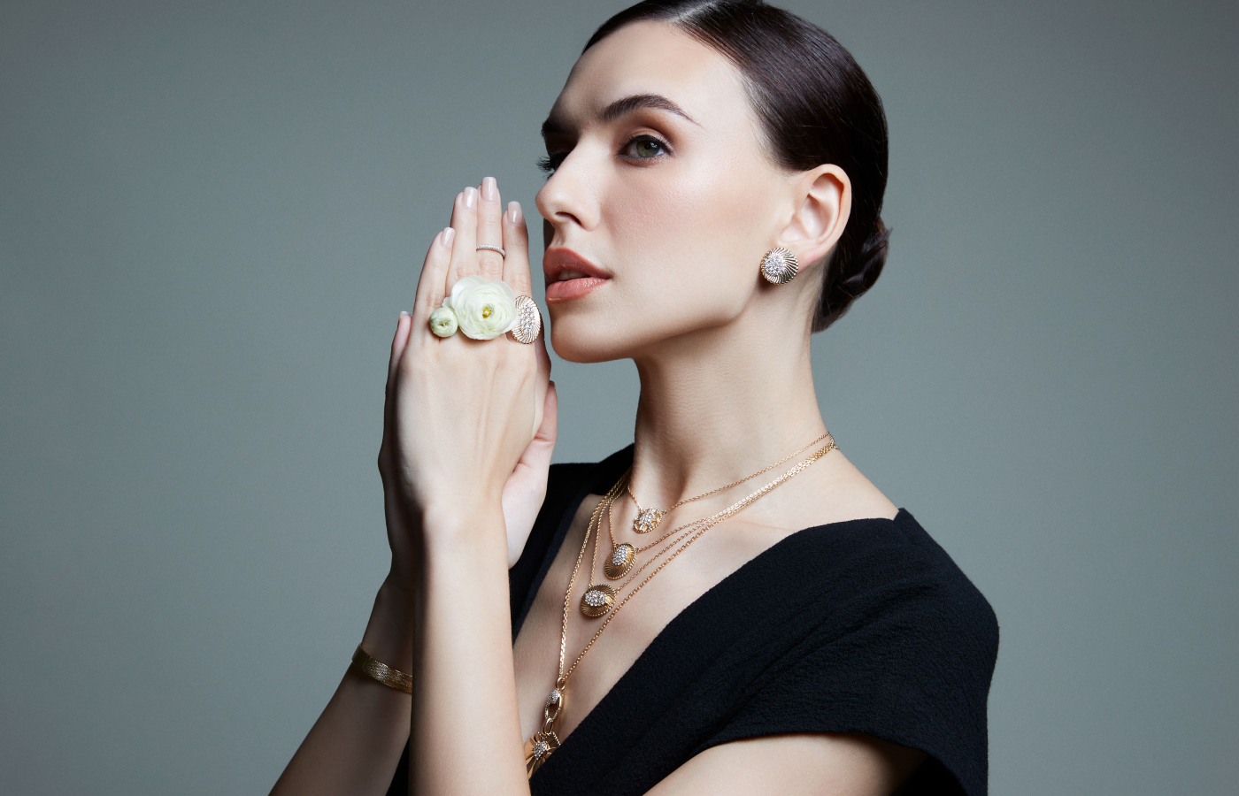 Model wearing Marceline Paris pieces from the Seven Sisters collection in gold and diamond 