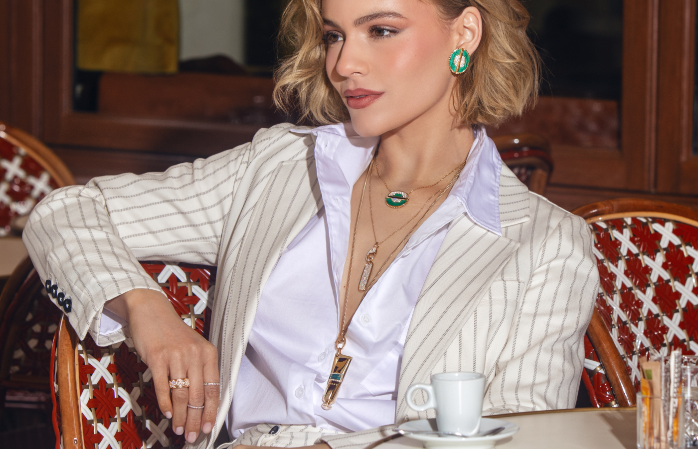  Model wearing Marceline Paris pieces from the As Above So Below collection,  The Seven Sisters collection and Awaken collection in gold, malachite and diamond 