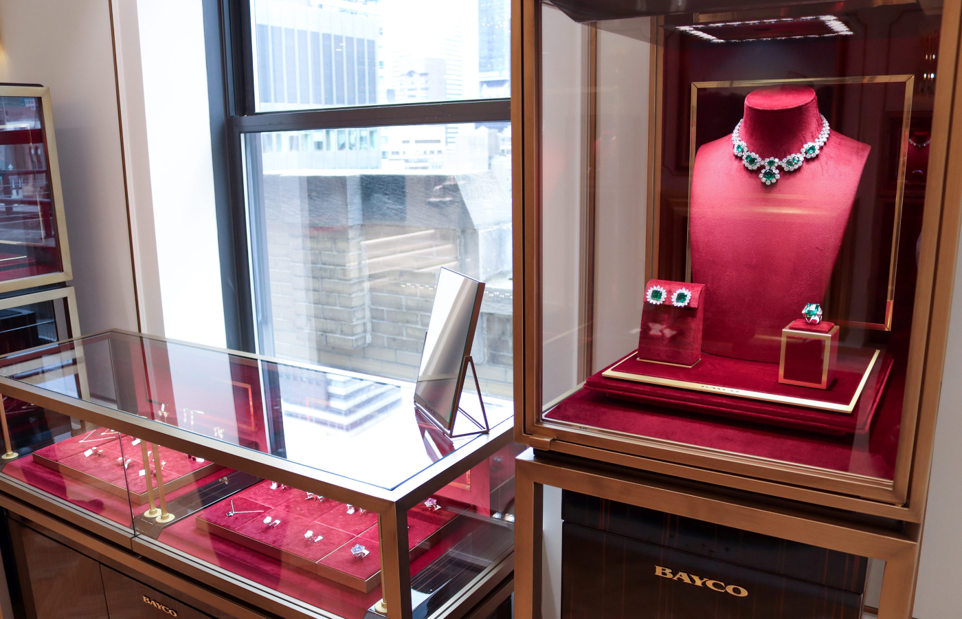  Jewellery cases at the Bayco Penthouse displaying one-of-a-kind emerald and diamond high jewellery designs