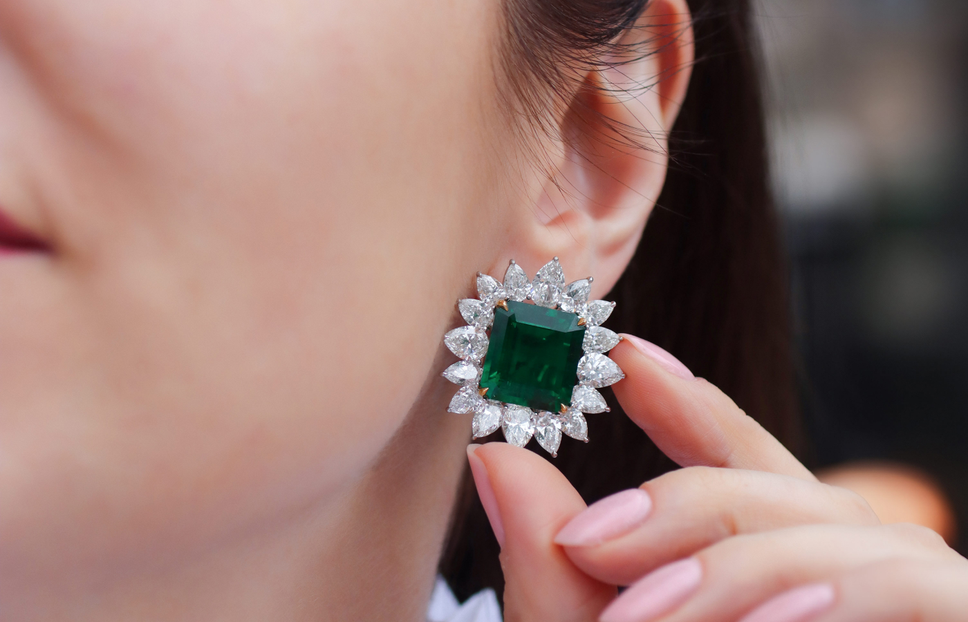  Katerina Perez wearing The Sublime Emeralds ear clips  in platinum and gold set with a pair of 24-ct Colombian emeralds and diamonds