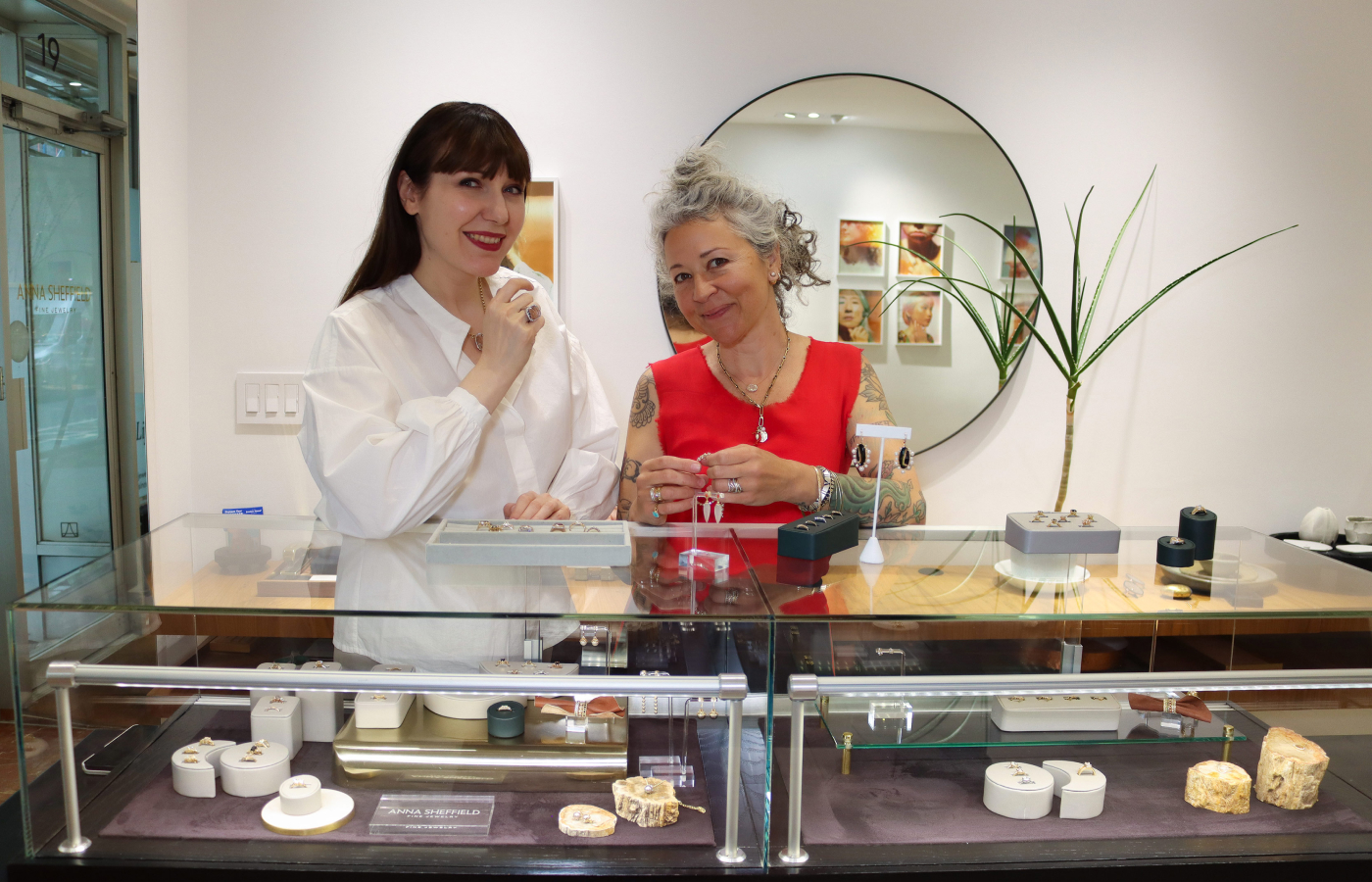 Katerina Perez with jewellery designer Anna Sheffield in front of the main jewellery case at the Bleecker St. Store in New York City