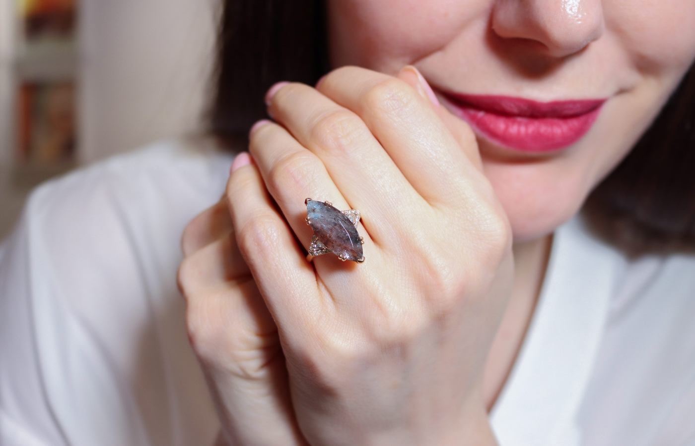 Katerina Perez wearing Anna Sheffield Terra Firma Series Marquise Bea ring in gold, leopard aquamarine, trillion-cut white Diamond and reclaimed white diamond melee