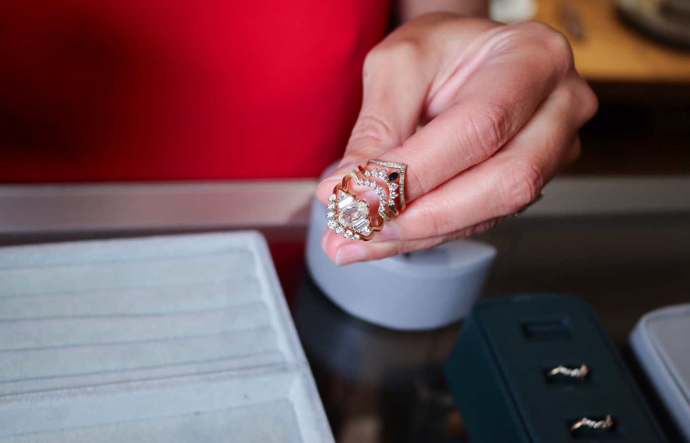  Anna Sheffield Theda Ring in gold, rose-cut champagne diamond and baguette and trillion-cut white diamond along with various Nesting Bands in gold and reclaimed white diamond