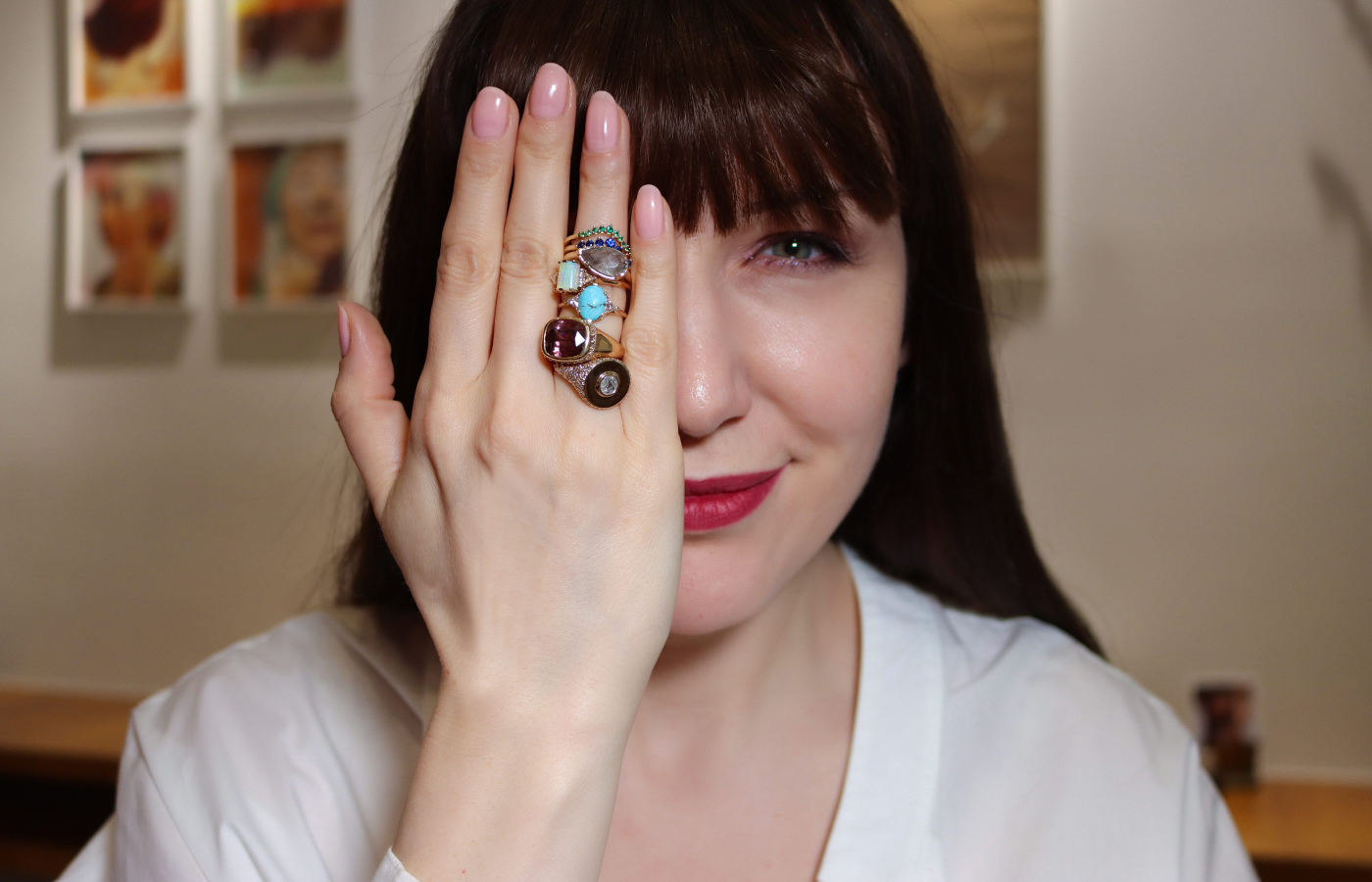 Katerina Perez wearing a mix of gemstone and diamond rings by Anna Sheffield