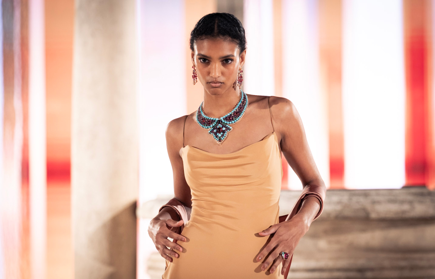  A Bulgari Aeterna High Jewellery collection necklace bursting with turquoise, worn by a model at the Terme di Diocleziano in Rome. Photo credit Gabriel De La Chapelle