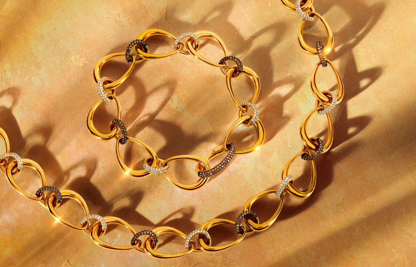  Le Vian® necklace with 1.37 carats of Nude Diamonds™ and 1.5 carats of Chocolate Diamonds® set in 14K Honey Gold™, alongside a matching bracelet