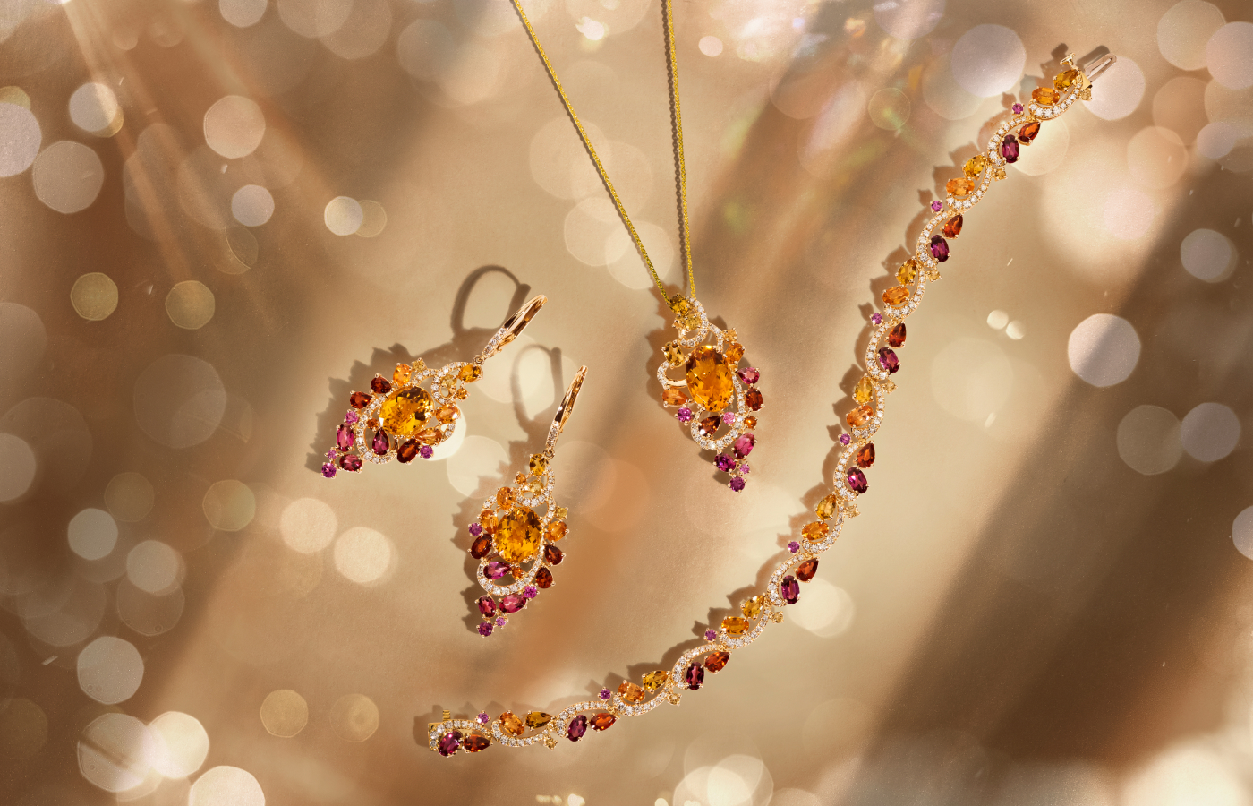  Le Vian Ombrè® pendant, earrings and bracelet set with Cinnamon Citrine®, Raspberry Rhodolite®, light and dark hues of spessartite garnet, further citrines and Vanilla Diamonds® in 14K Honey Gold™