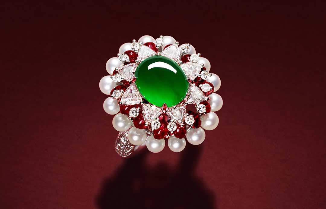 HEHE High Jewelry Dragon Harmony Dual Dragon Fetching Water ring from the Ascending Dragon High Jewellery collection with red spinel beads, a green jadeite cabochon, pearls, and diamonds 