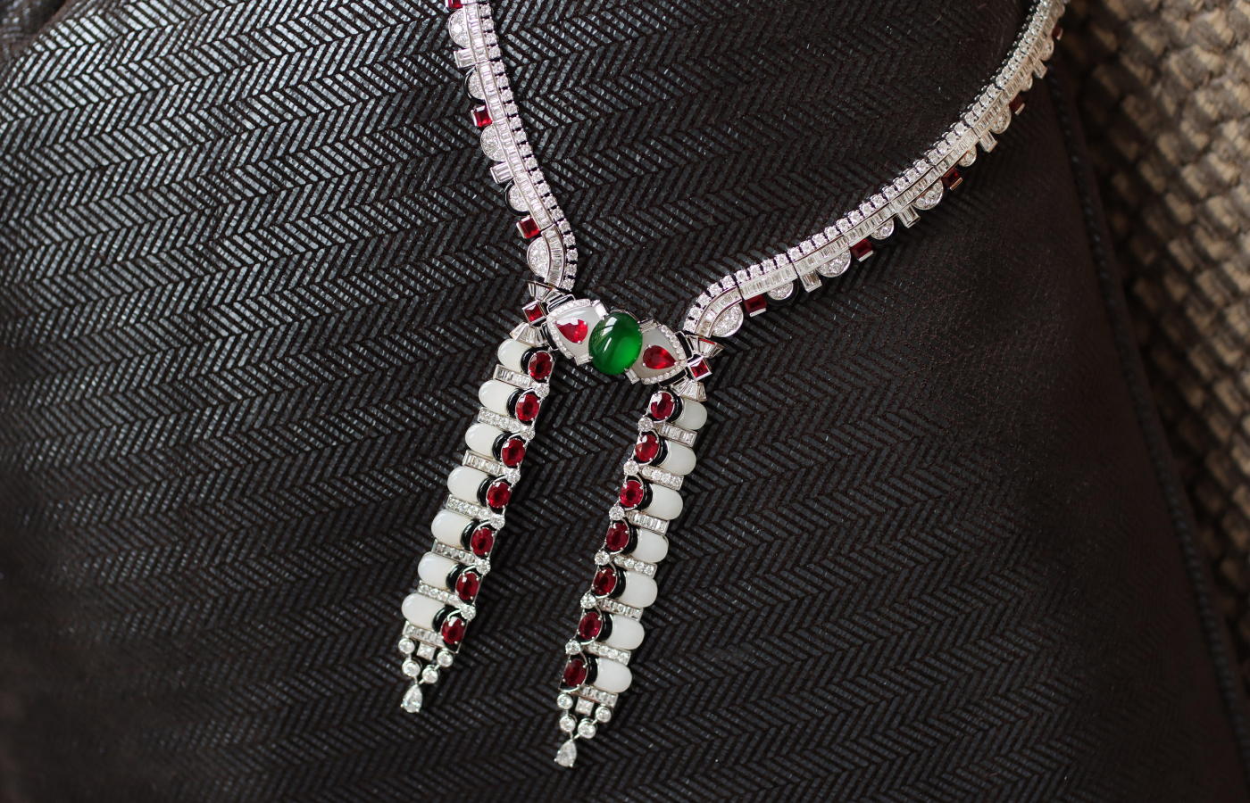  The HEHE High Jewelry Grand Harmony necklace from the National Grace collection with a green jadeite cabochon, oval-shaped rubies, onyx, white jade and diamonds is inspired by the architecture of the Forbidden City 