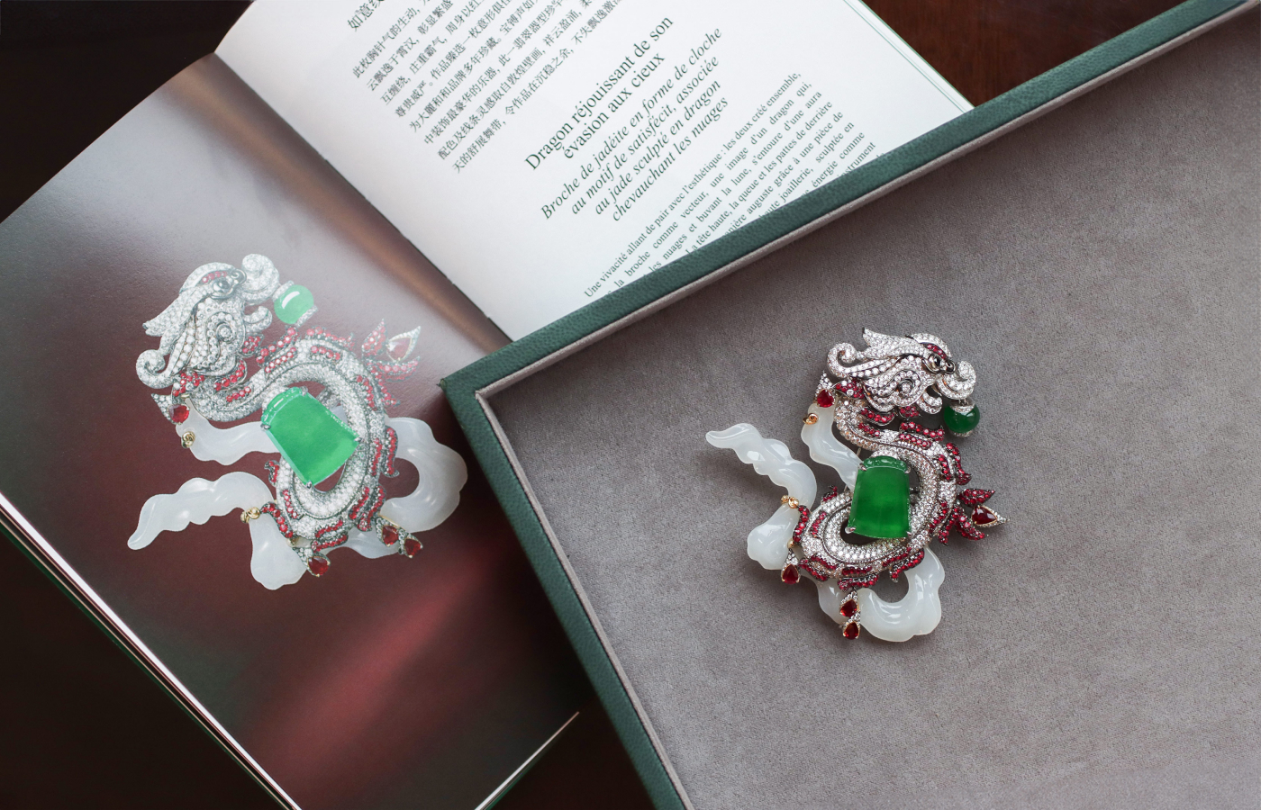 The HEHE High Jewelry Dragon Ascension brooch from the Ascending Dragon High Jewellery collection is crafted from white jade, with a shield-shaped green jadeite, a green jadeite bead, rubies and colourless diamonds 