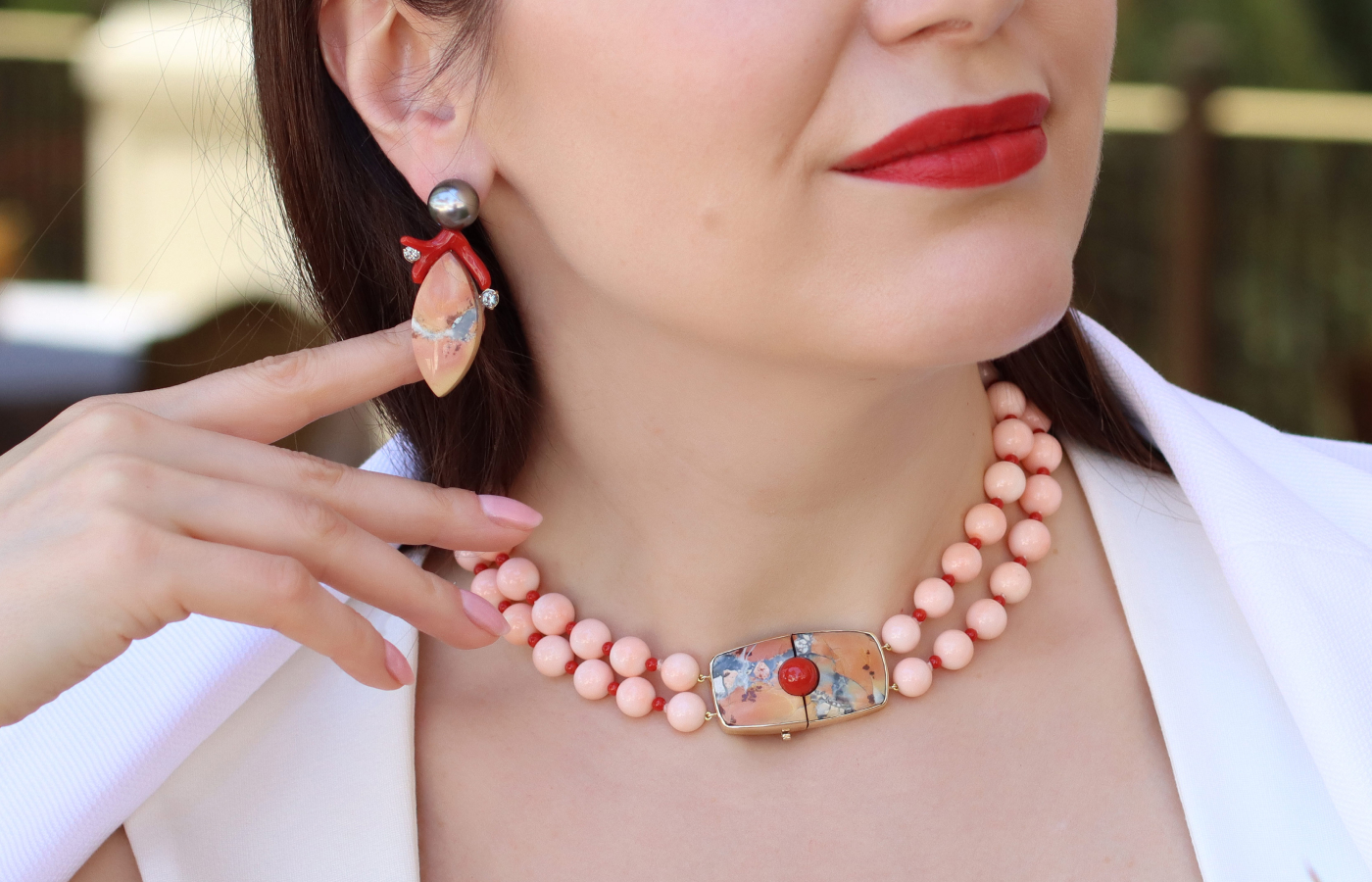  A closer look at the Assael creations worn by Katerina Perez, including an Angel Skin coral and Sardinian coral necklace and a pair of earrings with Tahitian pearls, Maligano jasper, coral and grey blue spinels, both set in 18k yellow gold 