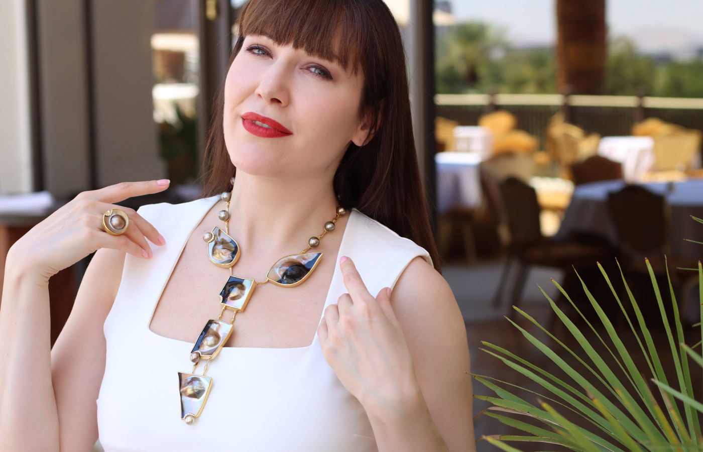 Katerina Perez wears the Assael Eclipse necklace with Fijian shell blisters, natural colour Fijian pearls and fancy yellow diamonds, set in 22k gold 