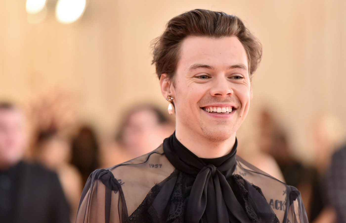  Singer Harry Styles wearing a single pearl drop earring
