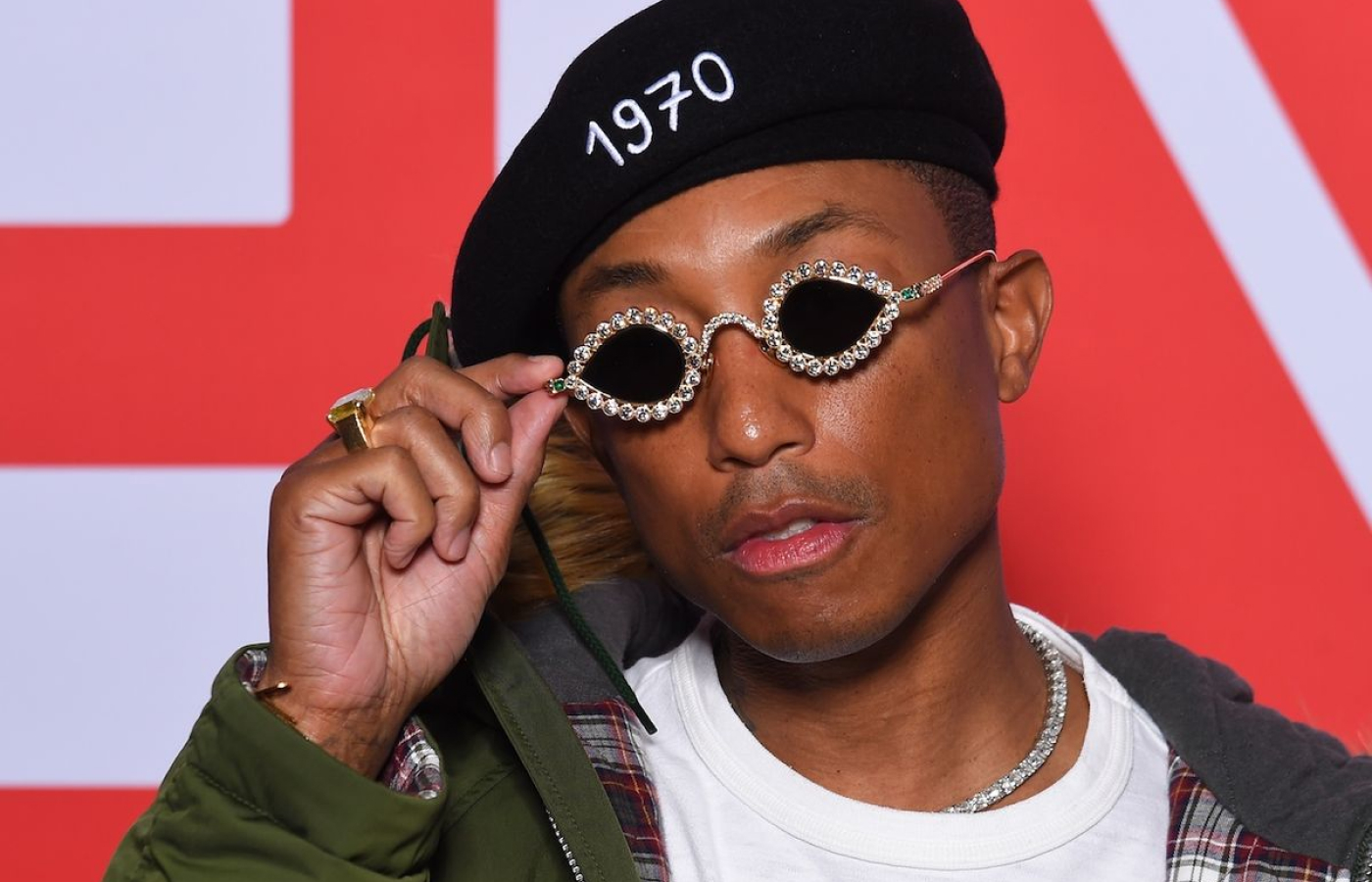 Pharrell Williams wearing his Tiffany & Co. sunglasses featuring 61 round brilliant diamonds and two emerald-cut emeralds