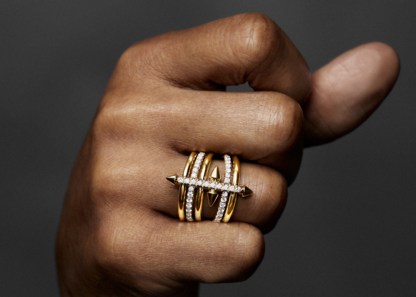 Pharrell Williams wearing Tiffany Titan by Pharrell Williams Five-row ring in gold and diamond