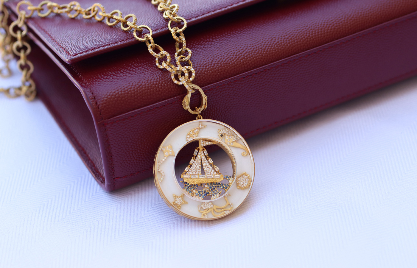 COOMI pendant in 20k yellow gold with 28.27 carats of white agate, 45.73 carats of rock crystal, 1.36 carats of diamonds, 0.54 carats of blue sapphire, and black spinel 