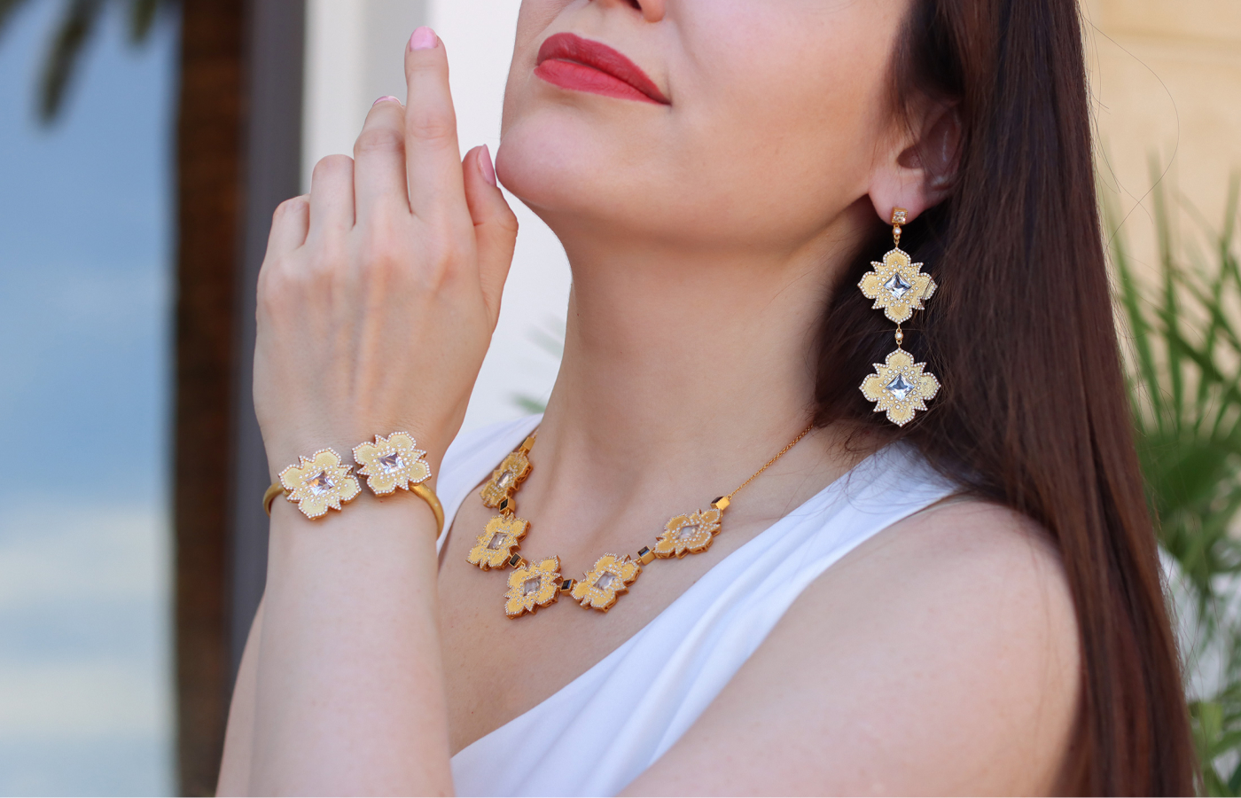  Katerina Perez wears the COOMI Trinetra earrings, necklace and bracelet, with the latter containing 1.73 carats of diamonds and 4.58 carats of rock crystal, all set in 20k yellow gold 