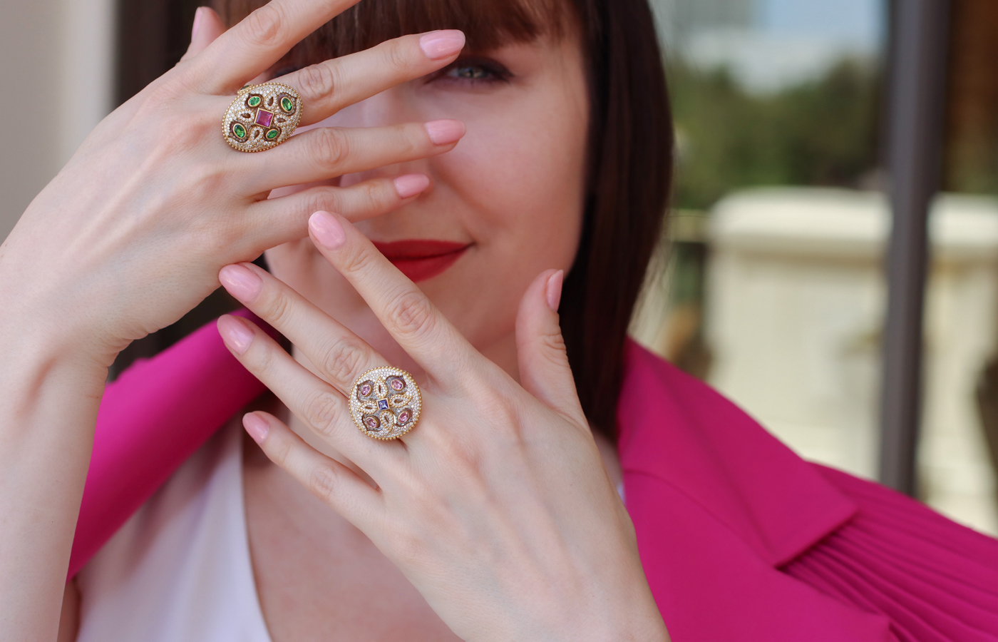 Katerina Perez wears the COOMI Trinetra ring (top) with 1.63 carats of diamonds, 14.15 carats of rock crystal, tsavorites and pink tourmalines and a second Trinetra ring with 1.73 carats of diamonds, pink tourmaline, tanzanite and 17.92 carats of rock crystal, both set in 20k yellow gold 