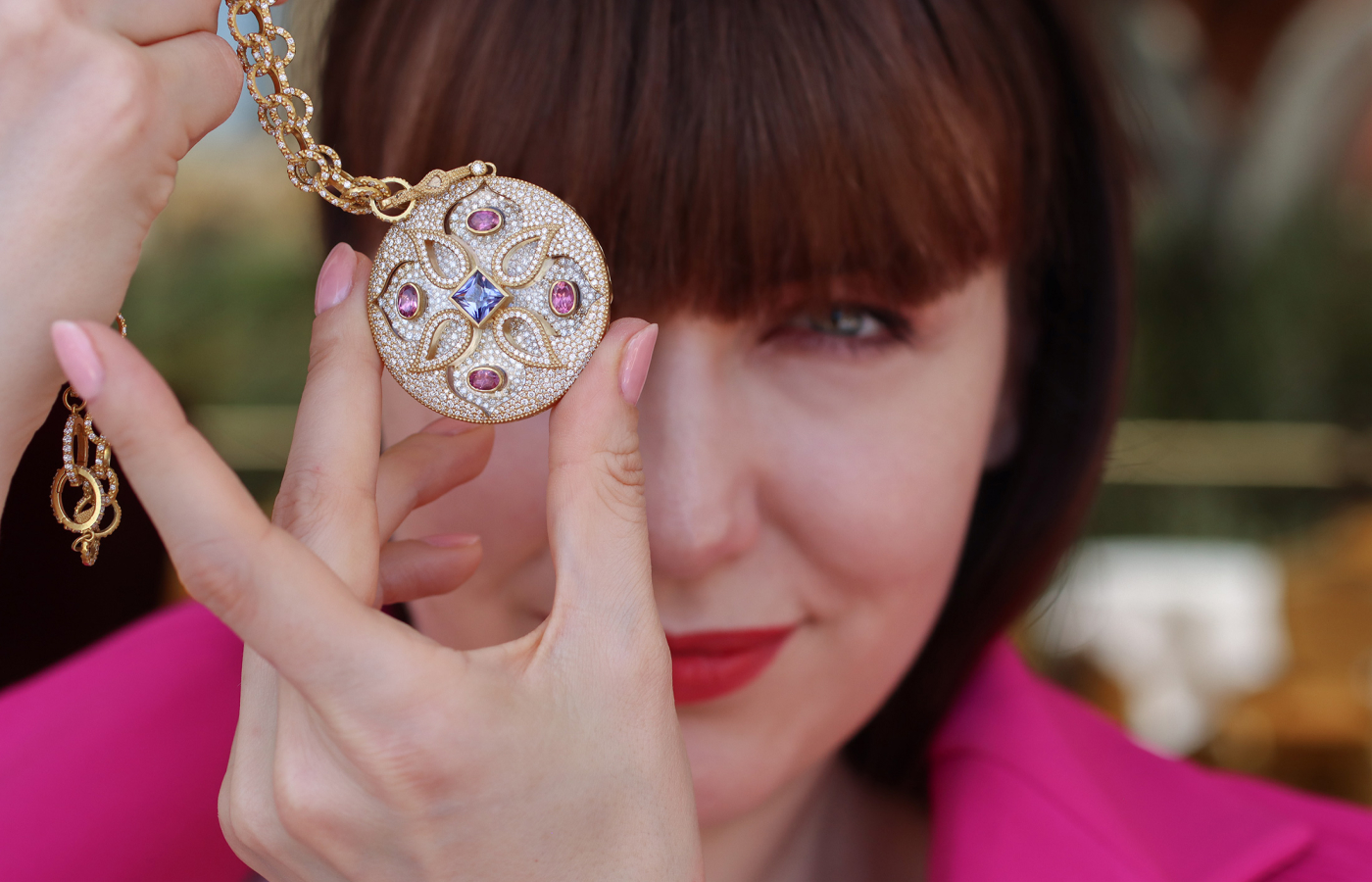  Katerina Perez showcases a COOMI Trinetra pendant with 5.34 carats of diamonds, 1.78 carats of tanzanite, 2.03 carats of tourmaline and 67.32 carats of rock crystal, set in 20k yellow gold 
