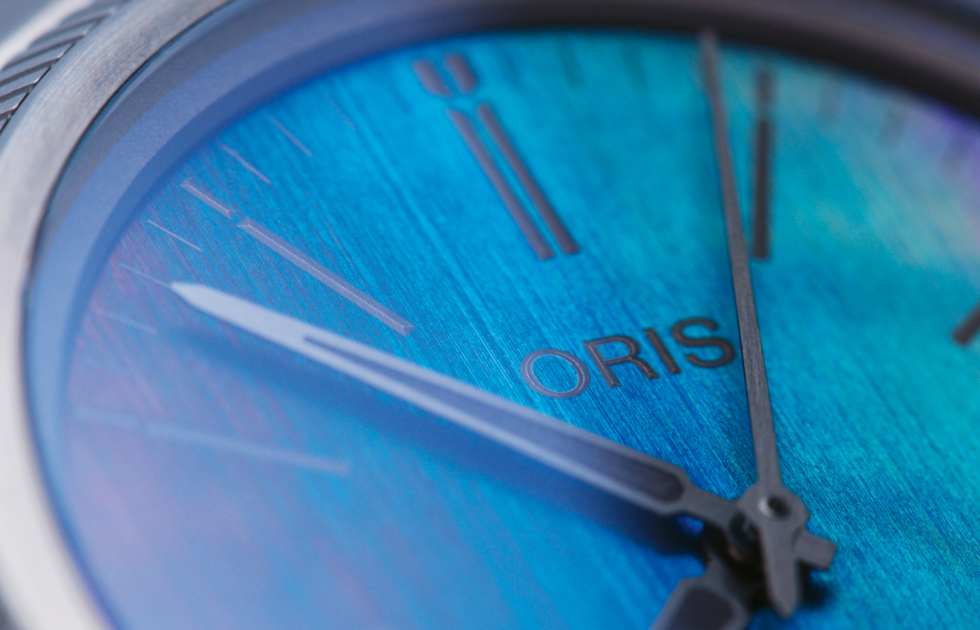  Each line has been carefully engraved into a titanium dial at a very specific depth to create optical interference known as biomimicry