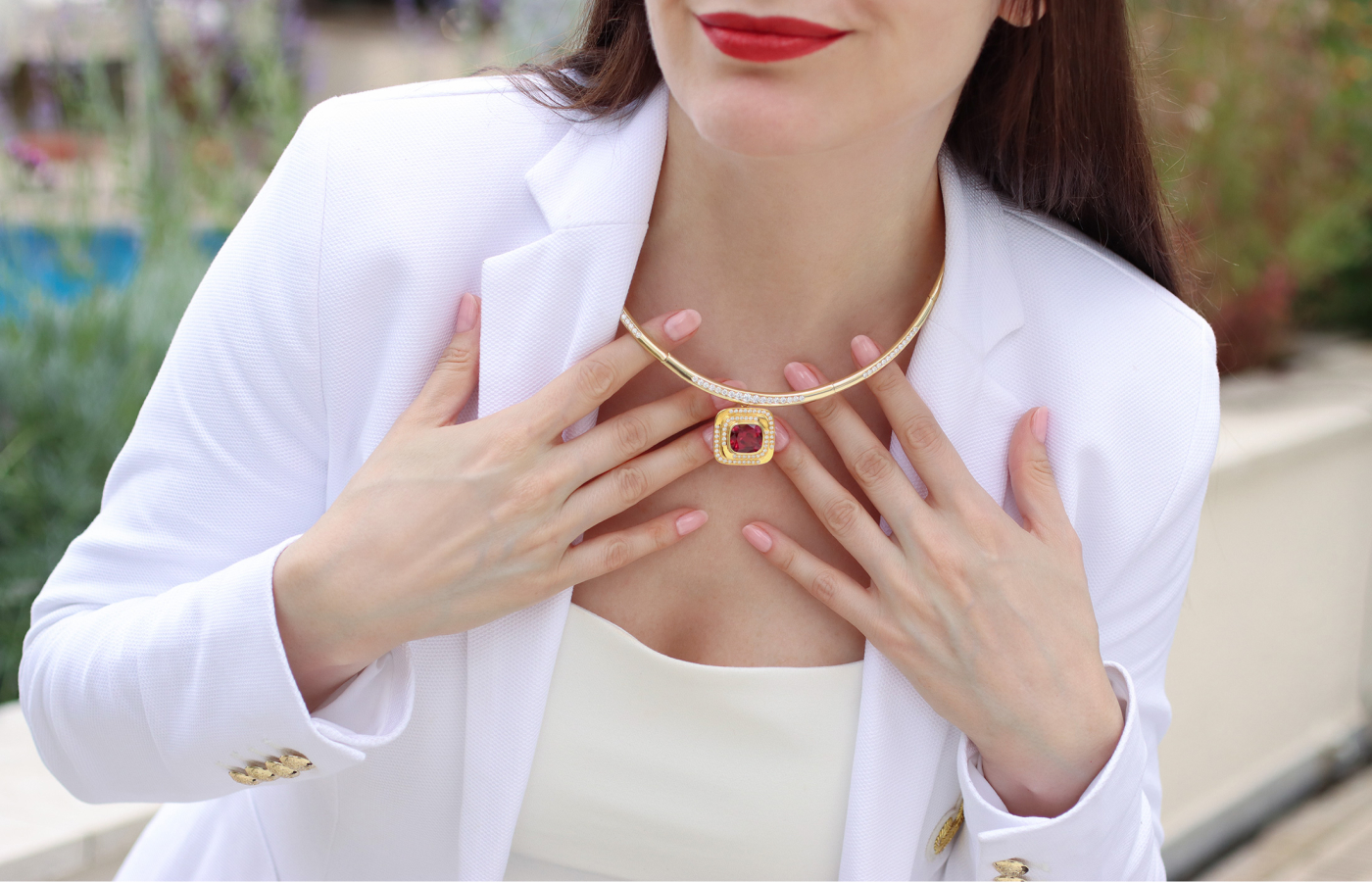 Katerina Perez wears the Florence Carr semi-flexible hinged torque necklace with 3.03 carats of diamonds and the detachable Maze pendant with a 9.78 carat rubellite and diamonds, both in 18k yellow gold