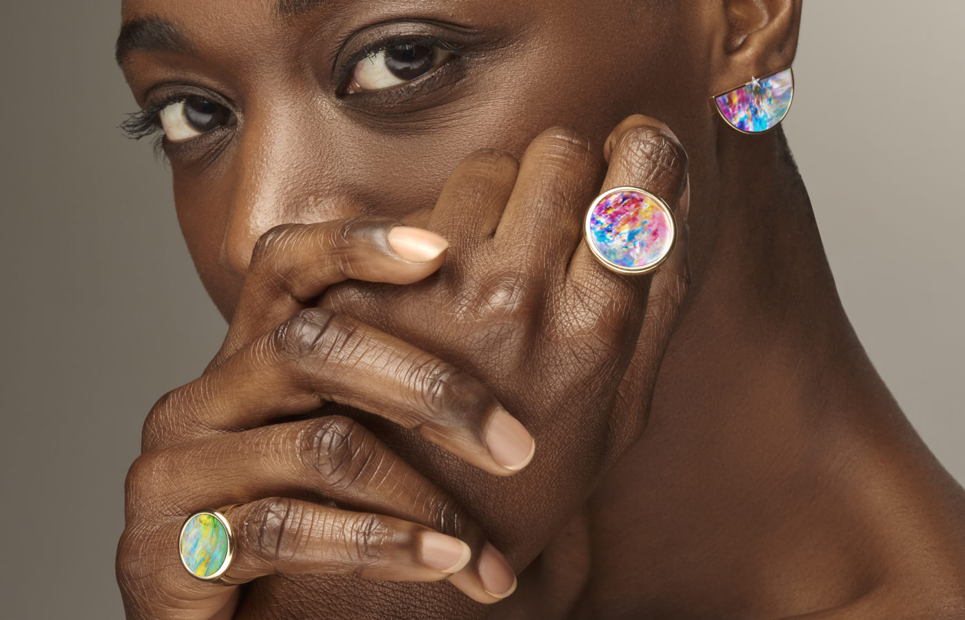  A model wears pieces from the Anna Maccieri Rossi Art Colore collection featuring hand-painted mother of pearl set in 18k yellow gold 