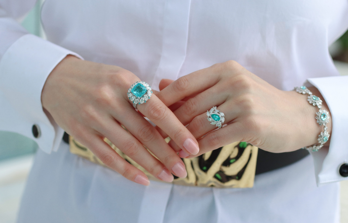 Katerina Perez wears jewellery by Gilin, including a 7.15 carat Paraiba tourmaline ring (left) with 5.12 carats of diamonds, a ring with a 0.89 carat Brazilian Paraiba and 1.50 carats of marquise-cut diamonds, and a bracelet with nine Paraibas totalling 4.42 carats with nearly 10 carats of diamonds, all in 18k white gold 