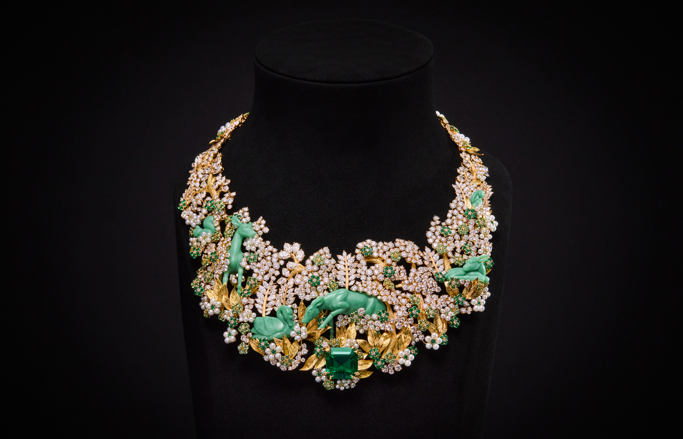 Diorama Foret Enchantée necklace from the Diorama & Diorigami High Jewellery collection, set with a 16.16 carat Colombian emerald, further emeralds, tsavorite garnets, diamonds, pearls and glyptic chrysoprase animals in engraved 18k yellow gold 