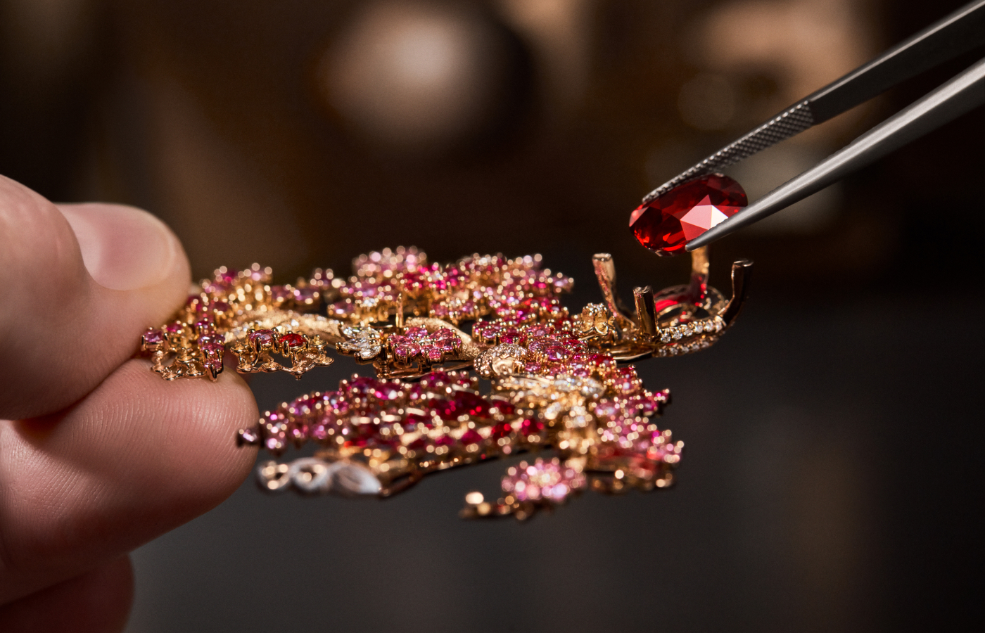  This Dior Joaillerie necklace centres on a 7.02 carat Mozambique ruby, set alongside further rubies in red and pink hues, pink sapphires, cultured pearls, diamonds and lacquer in the Diorama & Diorigami High Jewellery collection