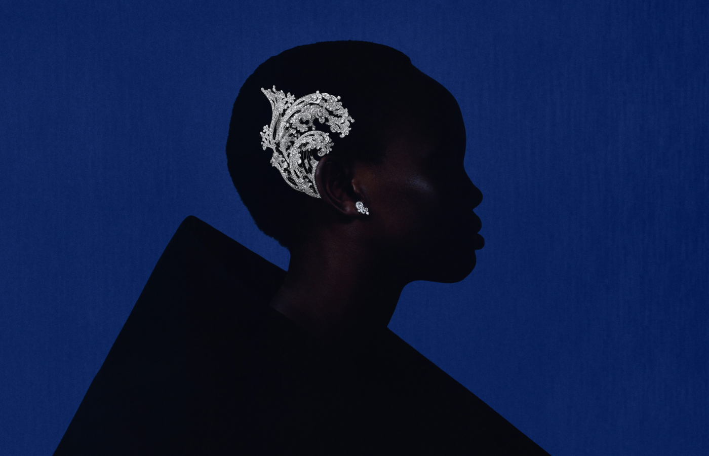 A model wears the Boucheron Vague asymmetrical earring inspired by Hokusai’s The Great Wave off Kanagawa, set with 851 round diamonds totalling 20 carats in 18k white gold, from the Or Bleu High Jewellery collection