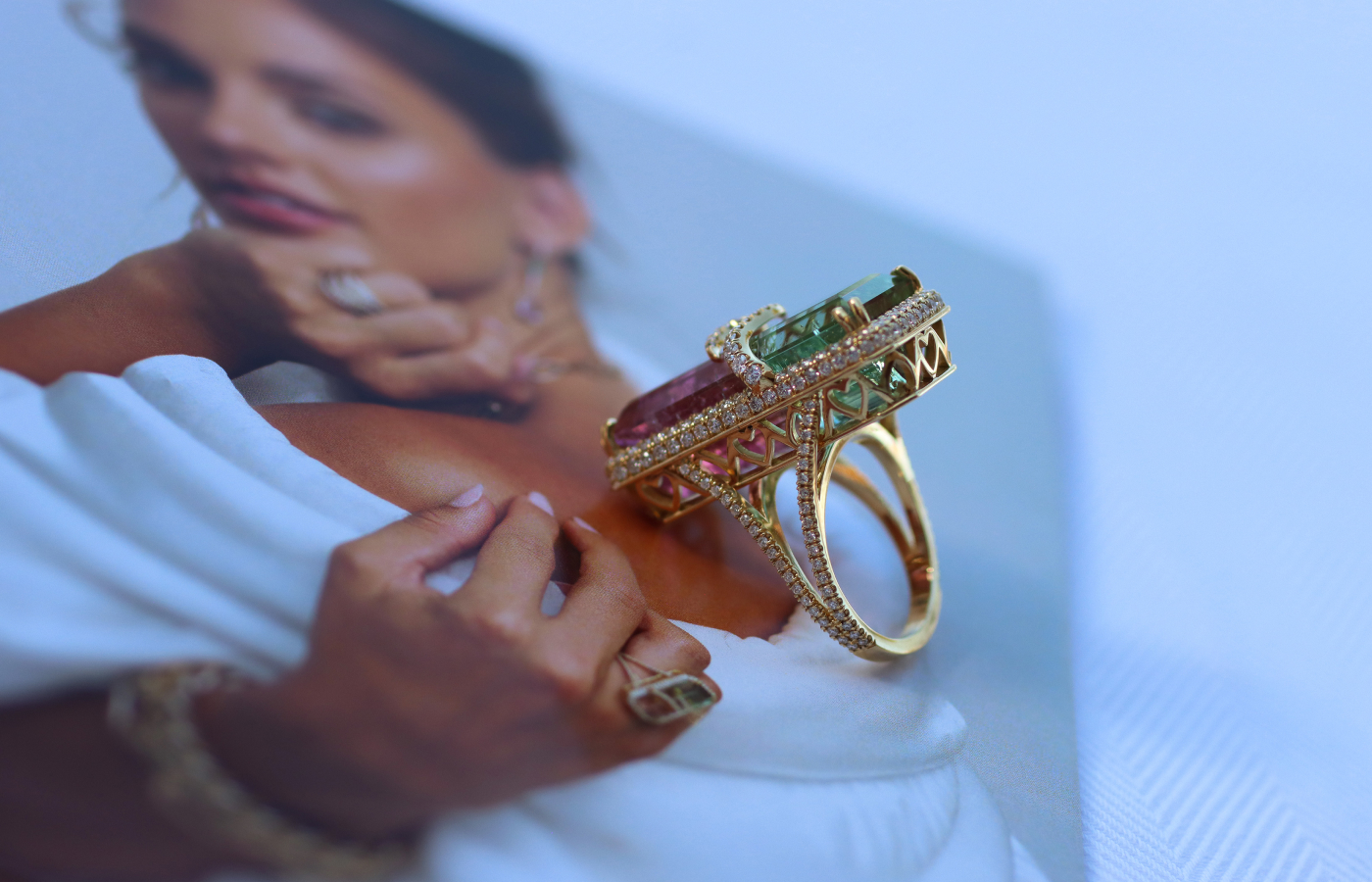  Heart-shaped details in the 18k yellow gold setting of a Colors collection cocktail ring by Lisa Nik, complete with 1.6 carats of diamonds and a 30.27 carat emerald-cut watermelon tourmaline  
