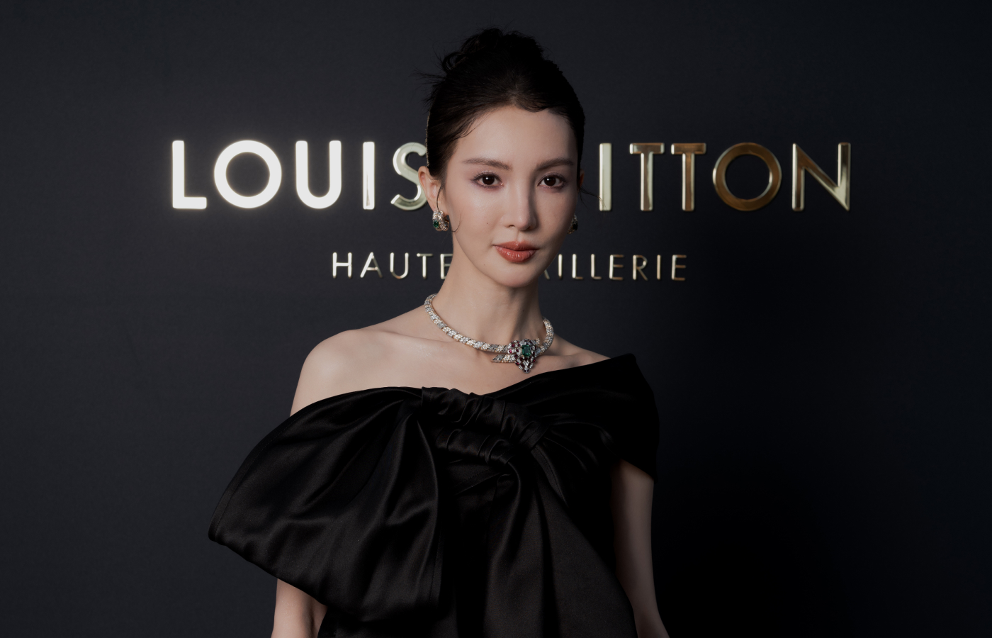  Jin Chen wearing Louis Vuitton high jewellery earrings and necklace at the launch of the Awakened Hands, Awakened Minds collection in St. Tropez