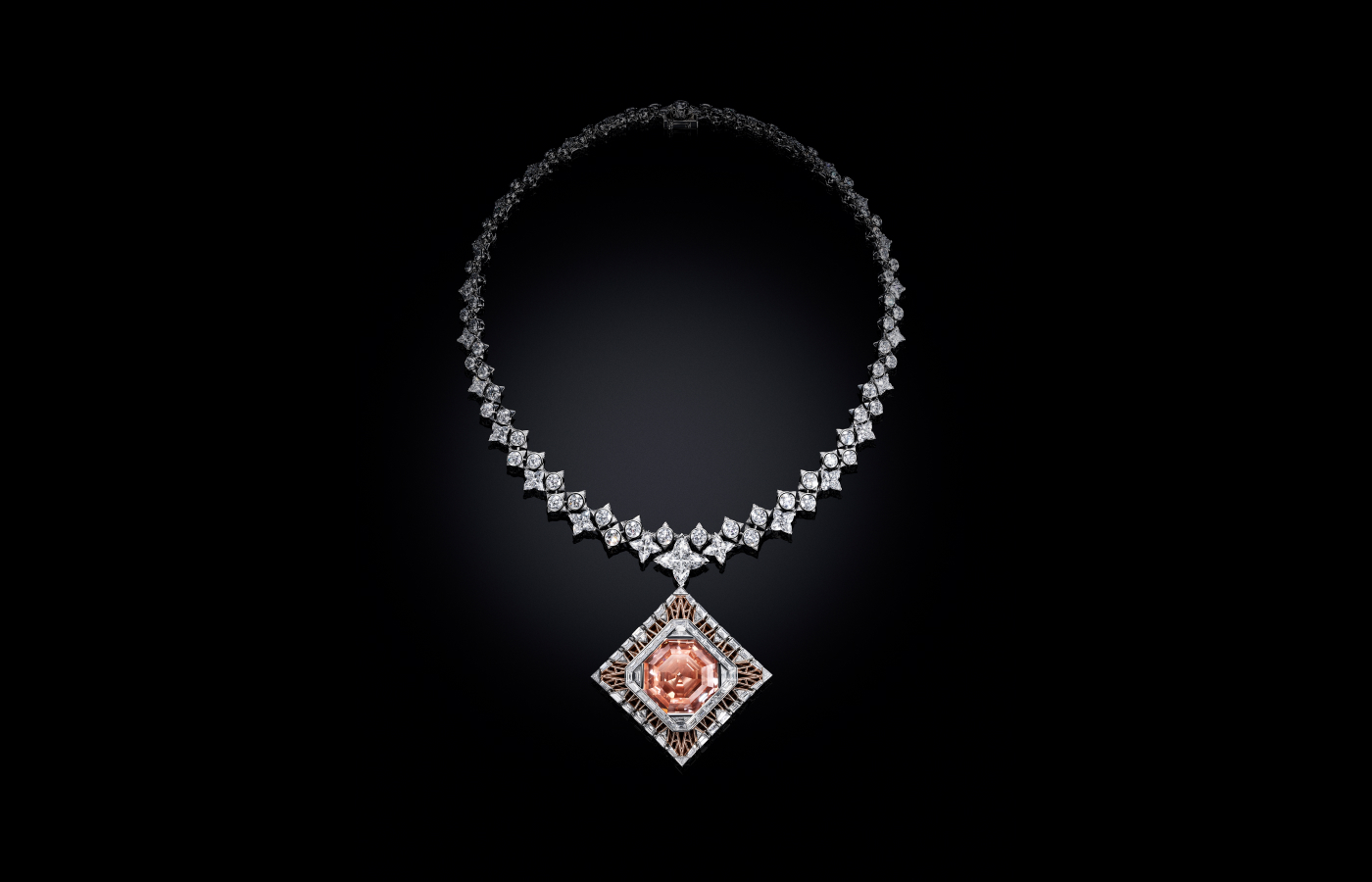 Louis Vuitton Cœur De Paris necklace with one 56.23 - carat fancy deep orangy-pink square emerald-cut diamond, one LV Monogram Star cut diamonds of 5.73 - carats, twenty-four LV Monogram Star cut diamonds for 15.90 - carats and diamonds in platinum and pink gold from the Awakened Hands, Awakened Minds collection