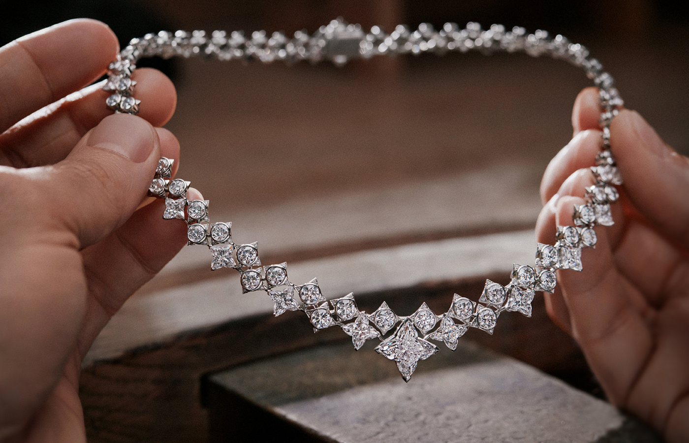  The  Louis Vuitton Cœur De Paris necklace from the Awakened Hands, Awakened Minds collection features the first ever Rivière necklace made of LV monogram diamonds and round brilliant diamonds