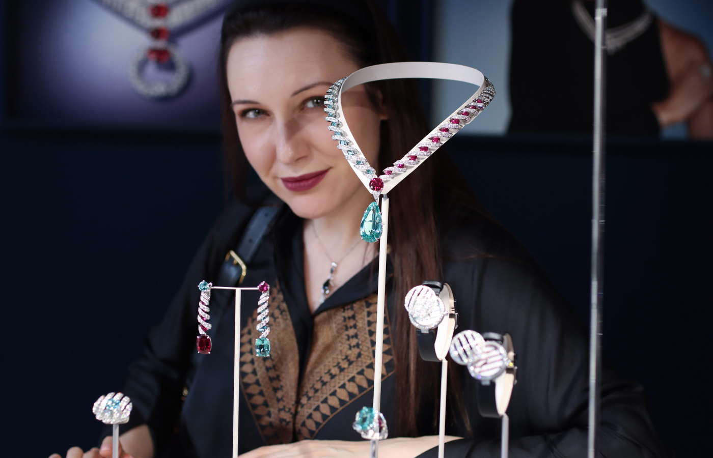 Katerina Perez with the Chaumet Tango ring, necklace and earrings from the En Scène collection with tourmaline, rubies and diamonds in 18k white gold, and a Tango watch with tourmalines and diamonds on a black satin strap