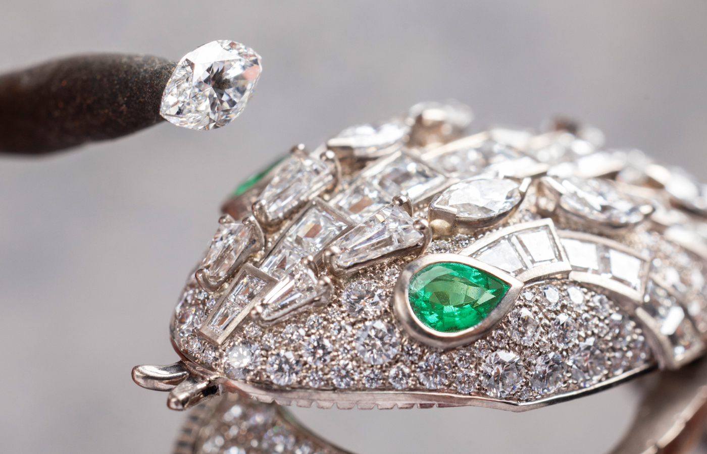  Applying a diamond onto the diamond and emerald Serpenti head from the Bvlgari Serpenti Misteriosi Dragone secret watch  from the Aeterna collection