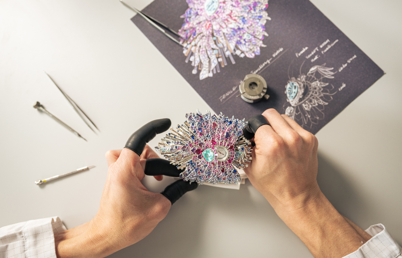  Making of the Bvlgari Fenice secret watch from the Aeterna collection with a Paraiba tourmalines, sapphires, rubies, tanzanites, aquamarines, iolites, pink garnettes, rhodolites, rubellites and pink tourmalines, amethysts and diamonds in 18k white and rose gold