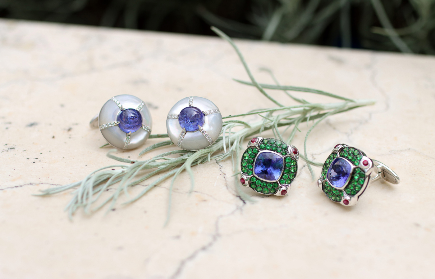 Two pairs of Maison J’OR cufflinks, including the Bon Bon design (left) with 7.91 carats of tanzanites, natural diamonds and mother of pearl in 18k white gold 