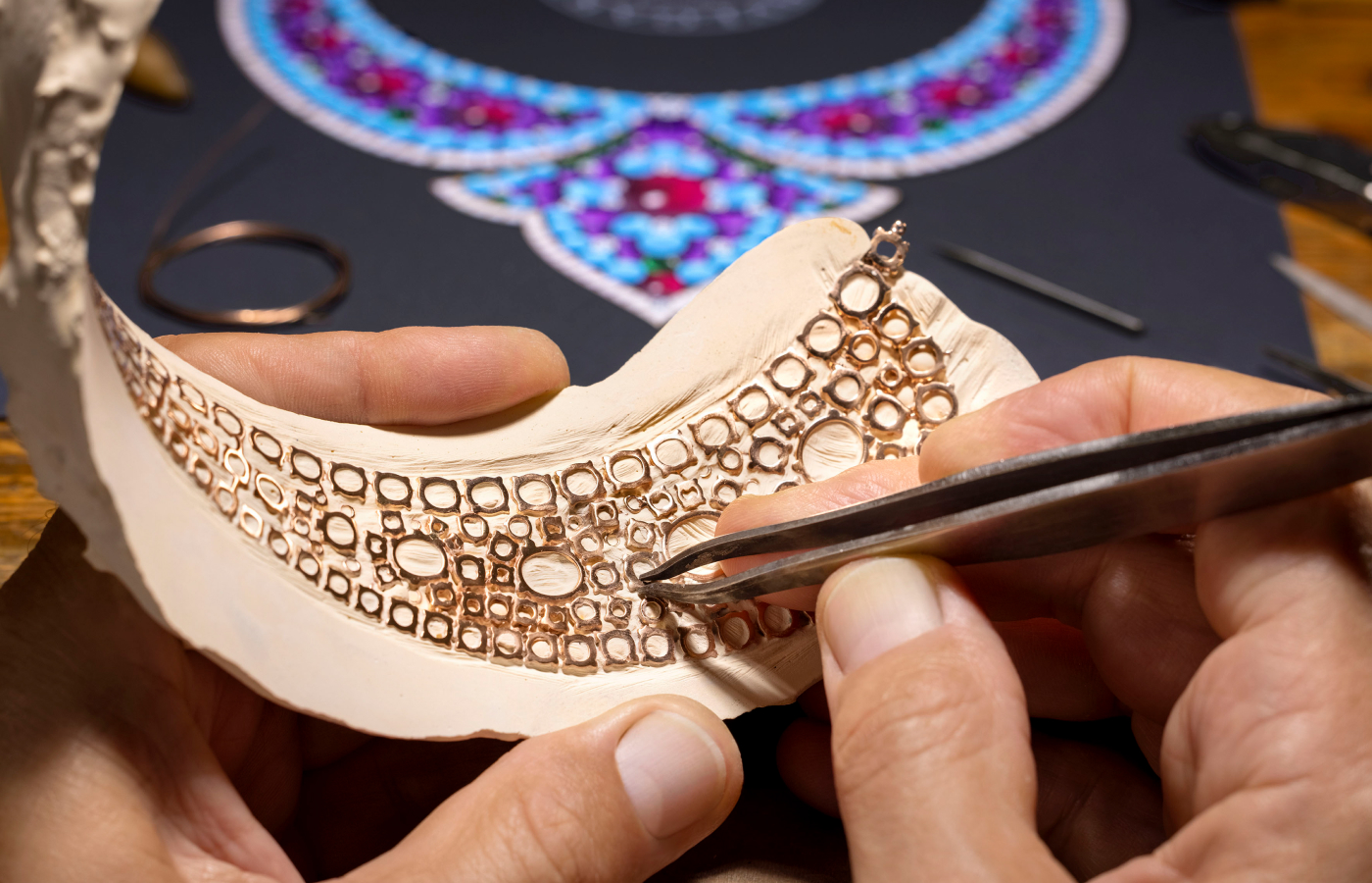  Bvlgari artisan setting the 18k yellow gold base of the Lotus Cabochon necklace from the Aeterna collection