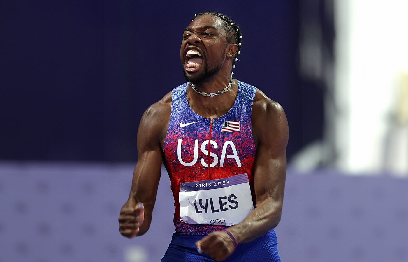  Sprinter Noah Lyles at the Olympic Games in Paris wearing a mariner link choker with yellow, black, and white diamonds