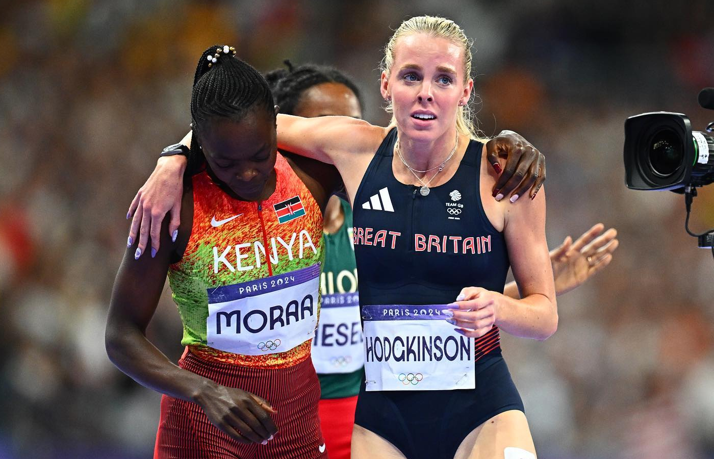  Keely Hodgkinson competing at the Paris 2024 Olympic games in a silver pendant engraved with 'Tokyo 2020'  and an OMEGA Seamaster Aqua Terra Ultra-Light watch on her right wrist