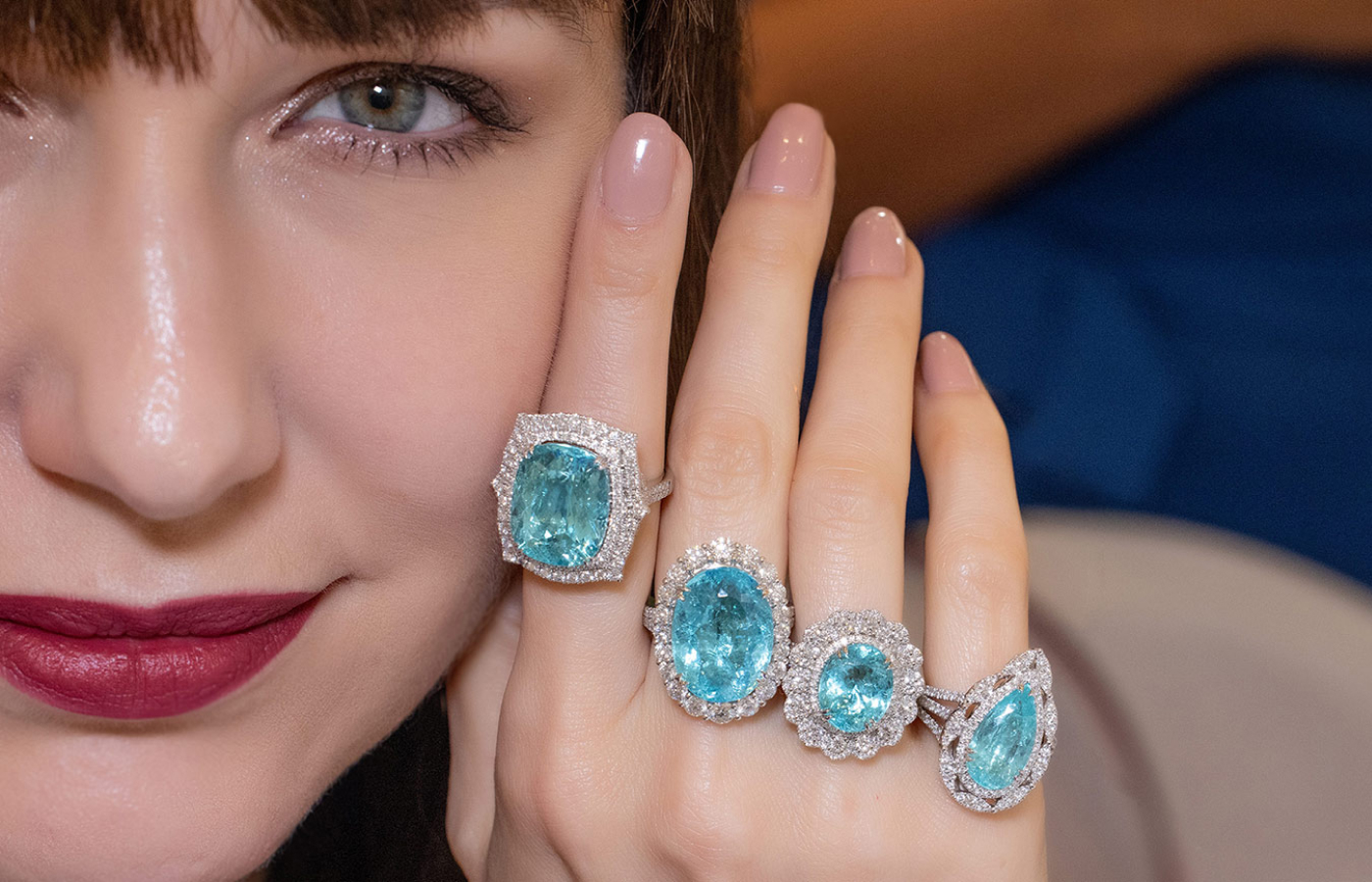  Katerina Perez wears a selection of Paraiba tourmaline and diamond rings by Le Vian