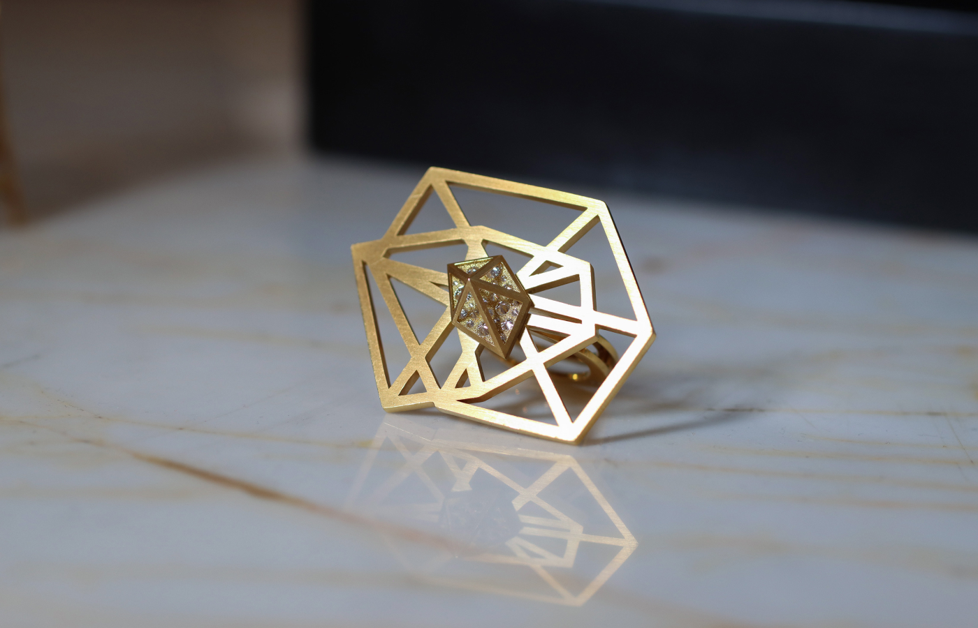  Robert Guild ring from the Shattered collection in brushed 18k yellow gold with reverse-set round brilliant-cut diamonds