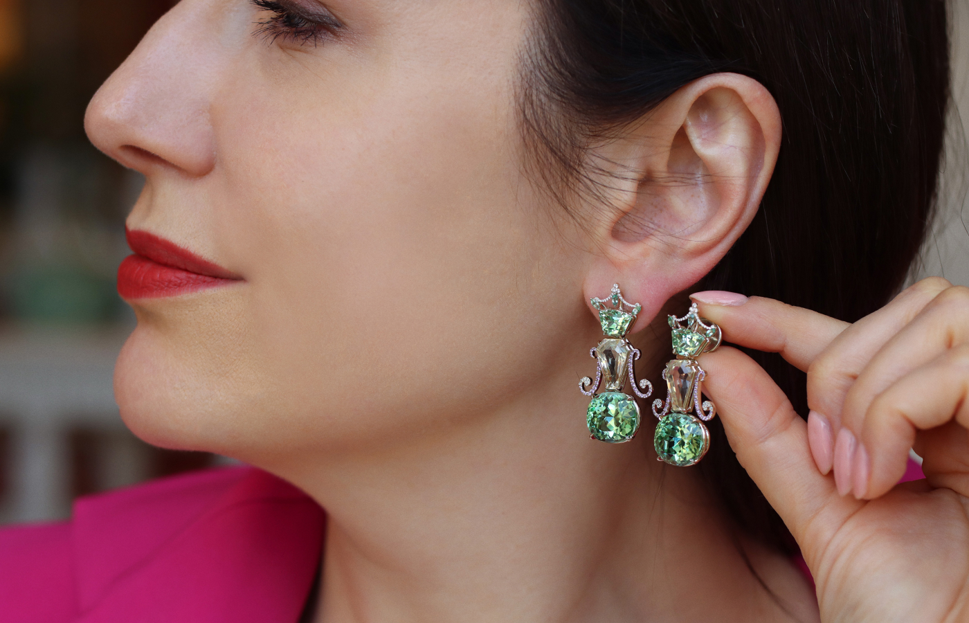  Katerina Perez wears the  Robert Guild QE II earrings set with a pair of rare kornerupines totalling 3.74 carats, 9.15 carats of yellow sapphires, and a pair of cushion-cut mint green tourmalines weighing 21.54 carats
