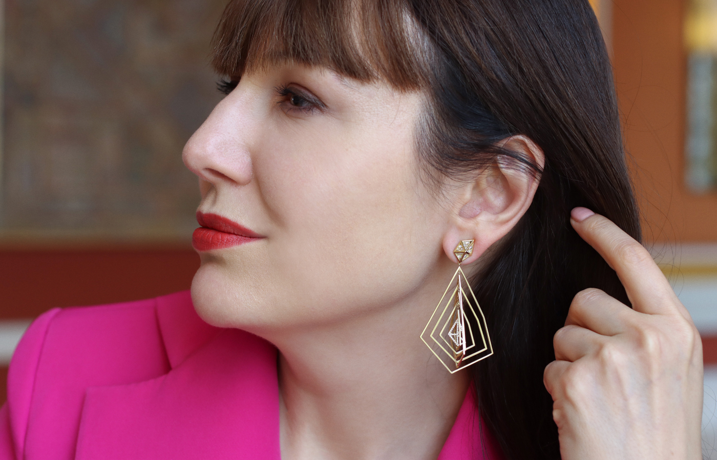  Katerina Perez wears the Robert Guild Orbiting Fractal earrings from the new Shattered collection with 164 reverse-set round brilliant-cut diamonds in brushed 18k yellow gold 