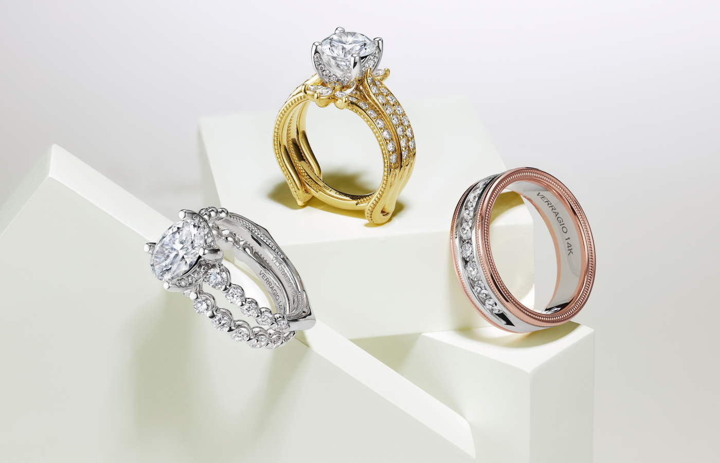 Vanguard Embellishers™️ from the Verragio Vanguard collection with engagement rings alongside a men’s band in 14k rose gold