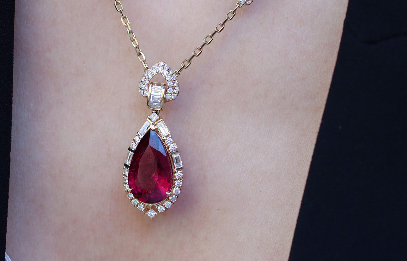 Sunita Nahata Celestial Dragon necklace with a 11.72 carat pear-shaped rubellite, baguette-cut diamonds, and princess- and round brilliant-cut diamonds, set in 18k yellow gold 