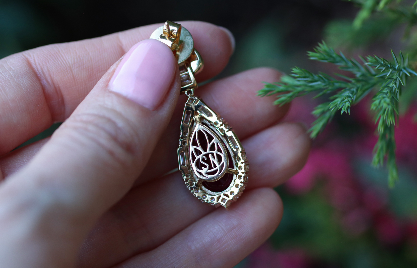  Details on the reverse of the Sunita Nahata Celestial Dragon necklace with a 11.72 carat pear-shaped rubellite, baguette-cut diamonds, and princess- and round brilliant-cut diamonds, set in 18k yellow gold 